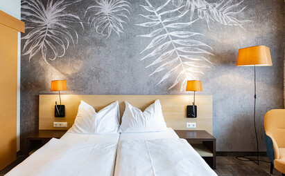 Eines der gemütlichen Betten im Hotel Das Himberg